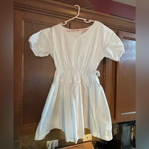 Brand new without tags white cotton v neck dress with bow detail at waist.